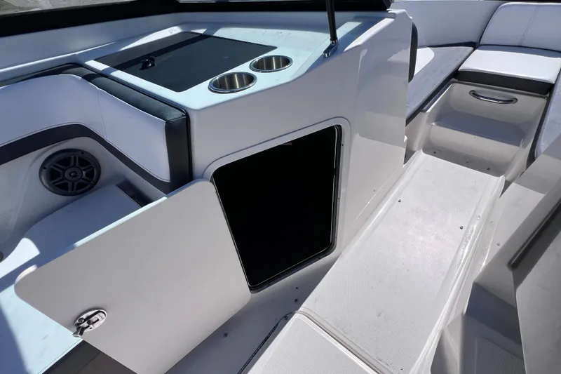 Slide: The Image of Interior of 2015 Sea Ray 21 SPX OB boat with open storage compartment. - 37