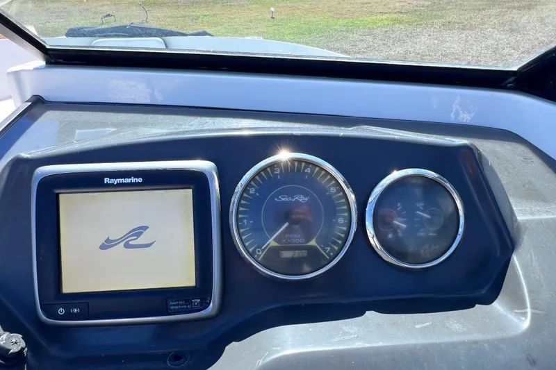 Slide: The Image of Dashboard of 2015 Sea Ray 21 SPX OB with Raymarine display and gauges. - 42
