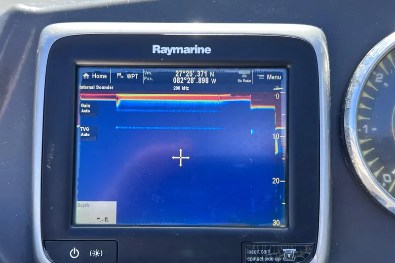 Slide: The Image of Raymarine display on 2015 Sea Ray 21 SPX OB showing sonar data and coordinates. - 46