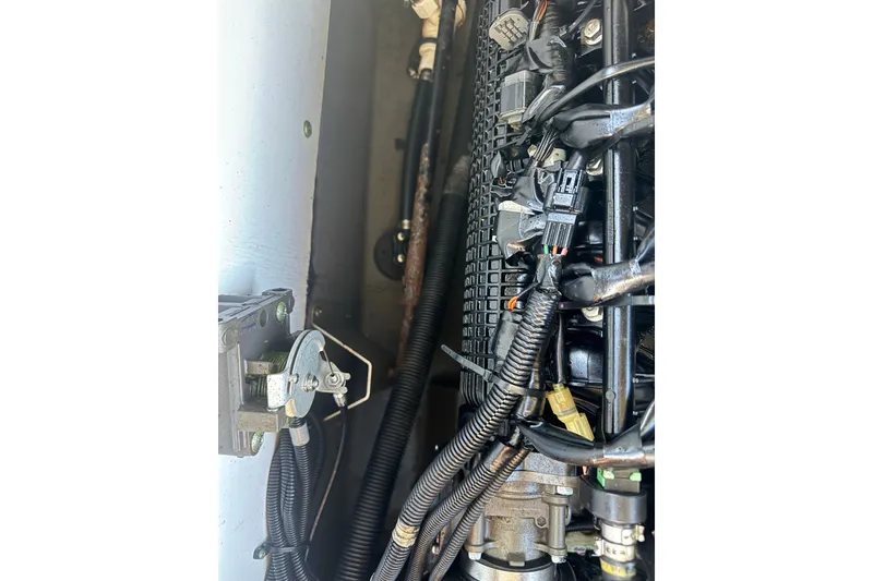 Slide: The Image of Engine components of a 2018 Yamaha Boats 190 FSH Deluxe, showcasing wiring and mechanical parts. - 35