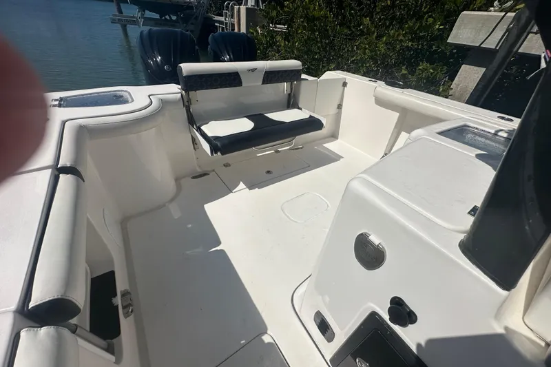 Slide: The Image of 2021 Tidewater 292 CC Adventure boat interior with luxurious seating and steering wheel. - 15