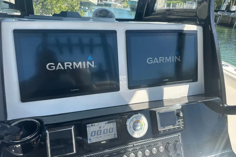 Slide: The Image of Battery compartment of 2021 Tidewater 292 CC Adventure boat, showing wiring and connections. - 23