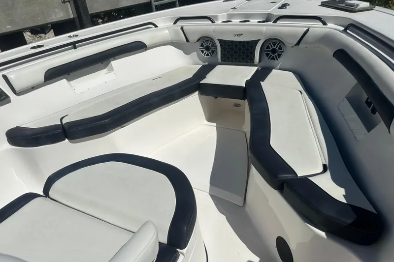 Slide: The Image of 2021 Tidewater 292 CC Adventure boat interior with seating and storage compartments. - 6