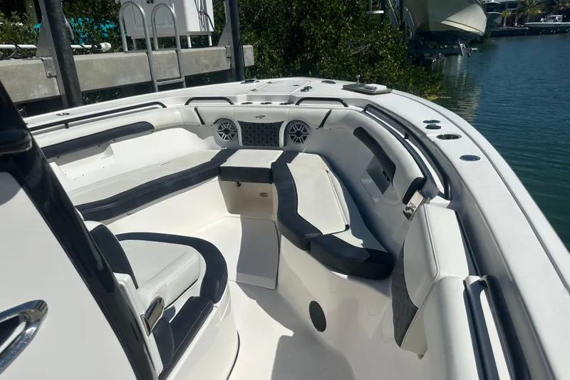 Slide: The Image of 2021 Tidewater 292 CC Adventure boat interior with storage compartments and seating. - 7