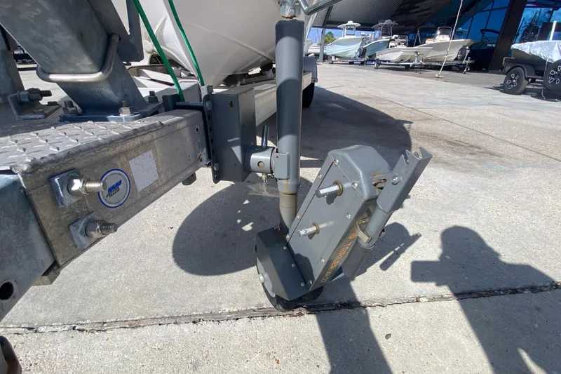 Slide: The Image of Trailer hitch of a 2014 NauticStar 214 XTS Shallow Bay boat in a marina. - 21
