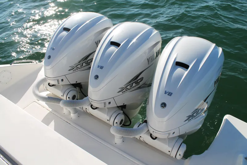 Slide: The Image of Triple Yamaha V8 outboard engines on 2023 Pursuit S 378 Sport boat in water. - 15