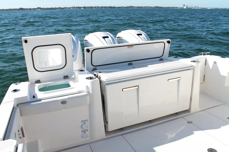 Slide: The Image of 2023 Pursuit S 378 Sport boat with dual engines on open water. - 18