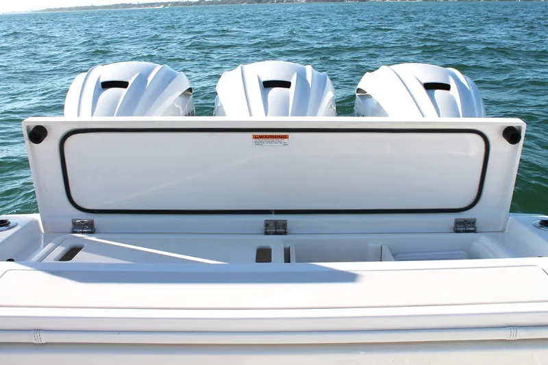 Slide: The Image of 2023 Pursuit S 378 Sport boat with triple engines on open water. - 20