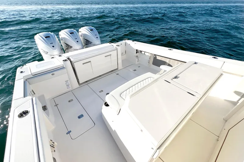 Slide: The Image of 2023 Pursuit S 378 Sport boat with triple engines on open water. - 21