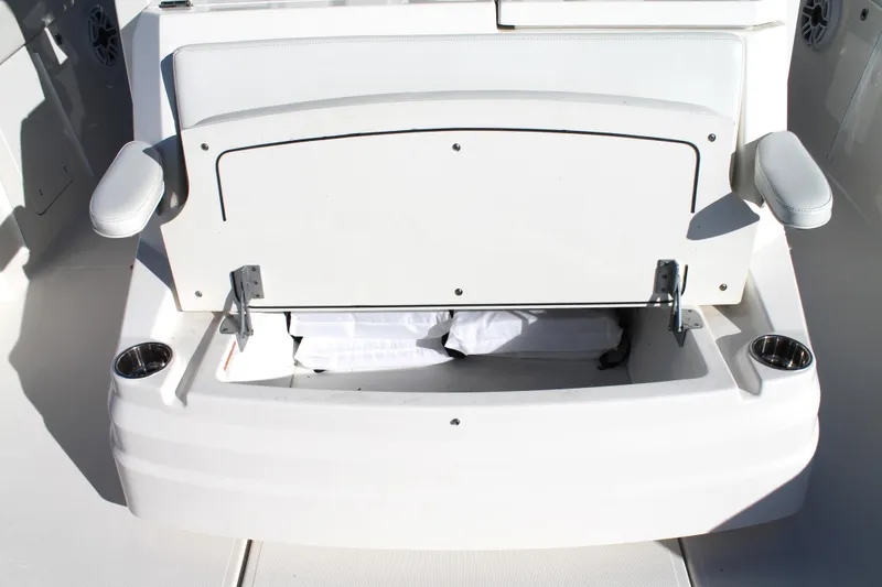 Slide: The Image of 2023 Pursuit S 378 Sport boat seat with storage compartment open. - 26