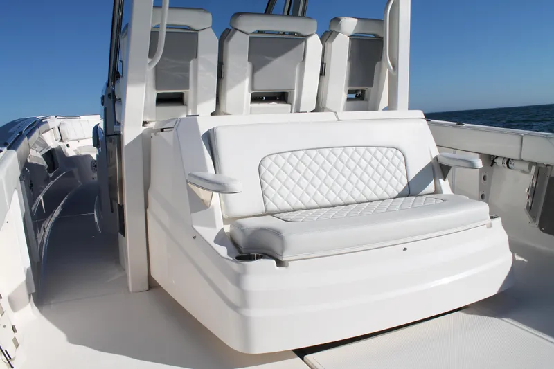 Slide: The Image of 2023 Pursuit S 378 Sport boat interior with white cushioned seating. - 27