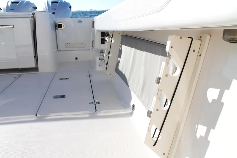 Slide: The Image of 2023 Pursuit S 378 Sport boat interior with storage compartments and sleek design. - 35