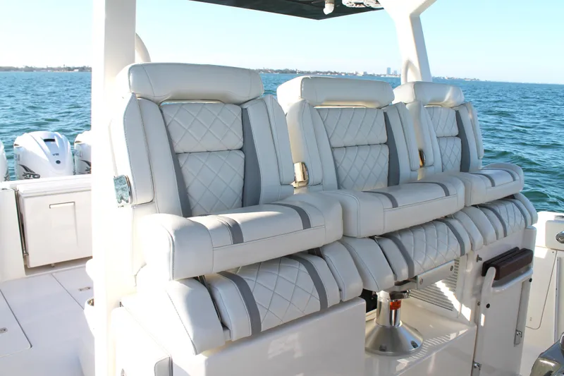 Slide: The Image of Luxurious seating on 2023 Pursuit S 378 Sport boat with ocean backdrop. - 40