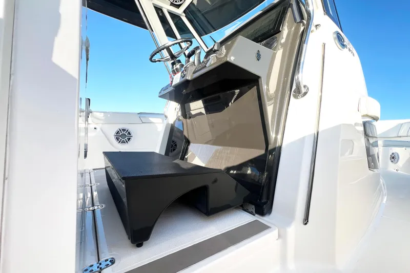 Slide: The Image of 2023 Pursuit S 378 Sport boat interior with helm and seating area. - 46