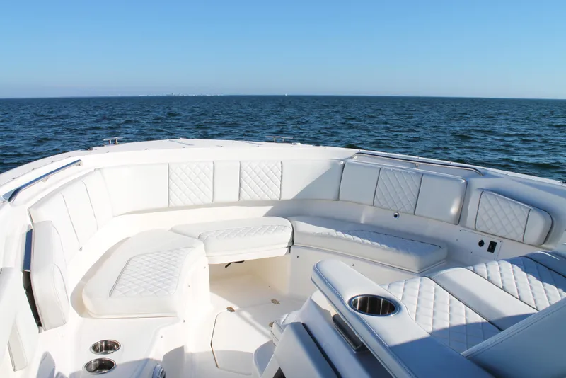 Slide: The Image of 2023 Pursuit S 378 Sport boat with luxurious seating on open water. - 50