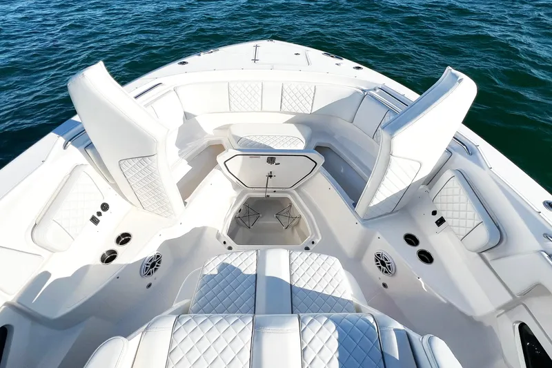 Slide: The Image of 2023 Pursuit S 378 Sport boat interior with luxurious seating and storage, on open water. - 53