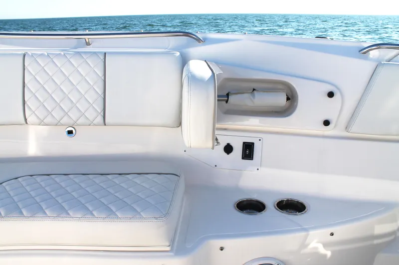 Slide: The Image of Luxurious seating on 2023 Pursuit S 378 Sport boat with ocean backdrop. - 55