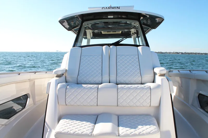 Slide: The Image of 2023 Pursuit S 378 Sport boat with luxurious seating on open water. - 57