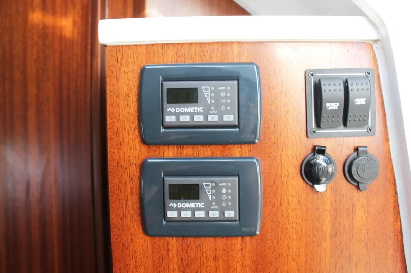 Slide: The Image of Control panel on 2023 Pursuit S 378 Sport boat with Dometic displays and switches. - 62