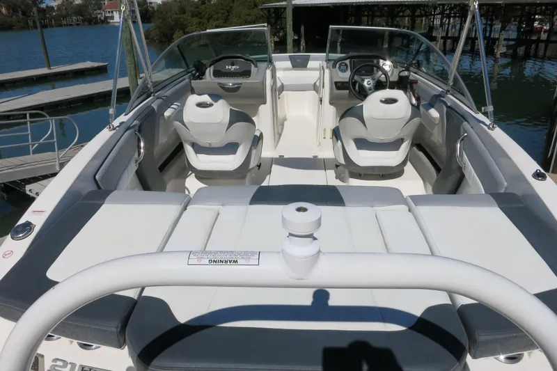 Slide: The Image of 2019 Chaparral 21 H2O Sport OB boat interior with seating and steering wheel. - 10