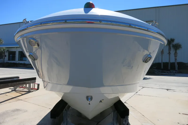 Slide: The Image of 2019 Chaparral 21 H2O Sport OB boat front view in outdoor setting. - 5