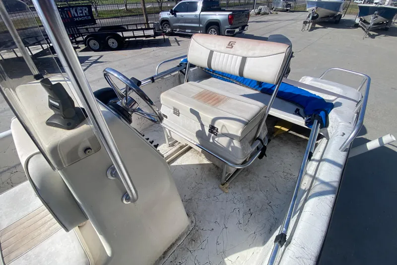 Slide: The Image of 2007 Carolina Skiff 1780 DLX boat interior with steering wheel and seating. - 16