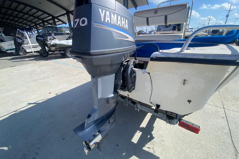 Slide: The Image of 2007 Carolina Skiff 1780 DLX with Yamaha 70 outboard motor, parked outdoors. - 18