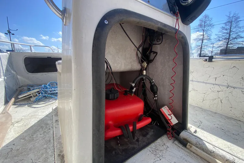 Slide: The Image of 2007 Carolina Skiff 1780 DLX boat interior with red fuel tank and wiring. - 20