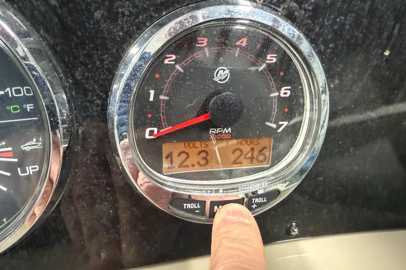 Slide: The Image of Close-up of 2007 Sea Ray 240 Sundancer RPM gauge showing 12.3 volts and 246 hours. - 22