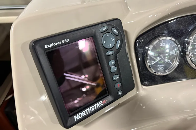 Slide: The Image of Northstar Explorer 650 on 2007 Sea Ray 240 Sundancer dashboard with gauges. - 9