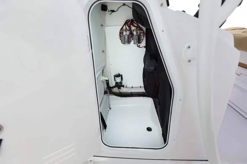 Slide: The Image of Manufacturer Provided Image: 2022 Sportsman Tournament 234 Bay Boat storage compartment with electrical components. - 12