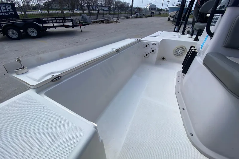 Slide: The Image of 2022 Composite Research Spyder FX-19 Vapor boat interior with open storage compartment. - 19