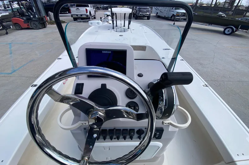 Slide: The Image of 2022 Composite Research Spyder FX-19 Vapor boat console with steering wheel and controls. - 24