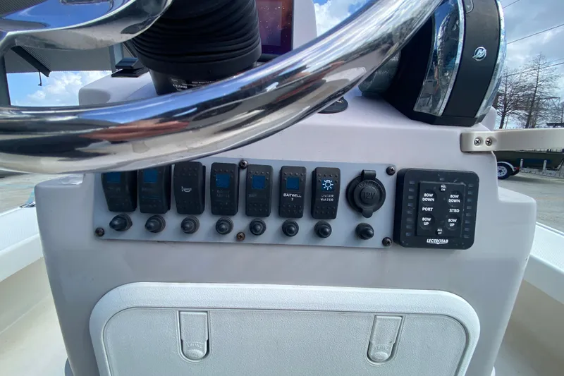 Slide: The Image of Control panel of 2022 Composite Research Spyder FX-19 Vapor boat with steering wheel and switches. - 25