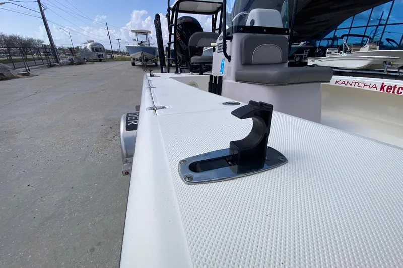 Slide: The Image of 2022 Composite Research Spyder FX-19 Vapor boat, docked with visible seating and equipment. - 28