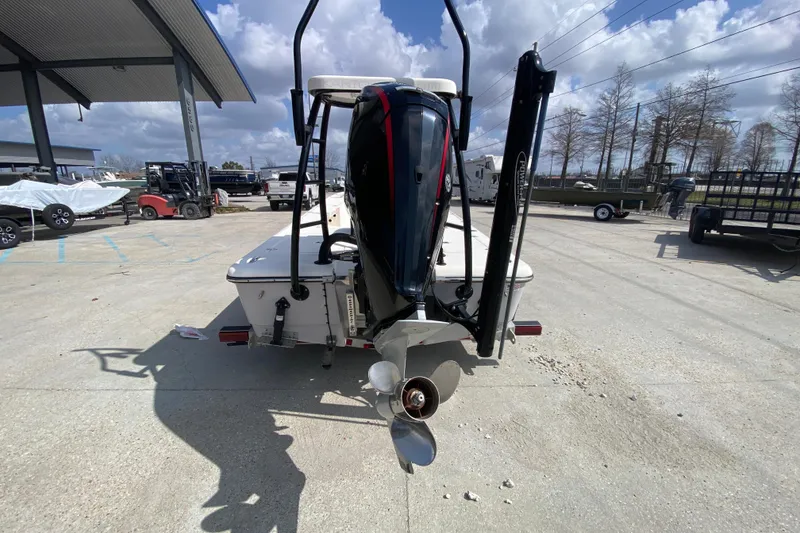 Slide: The Image of 2022 Composite Research Spyder FX-19 Vapor boat with outboard motor, parked outdoors. - 7