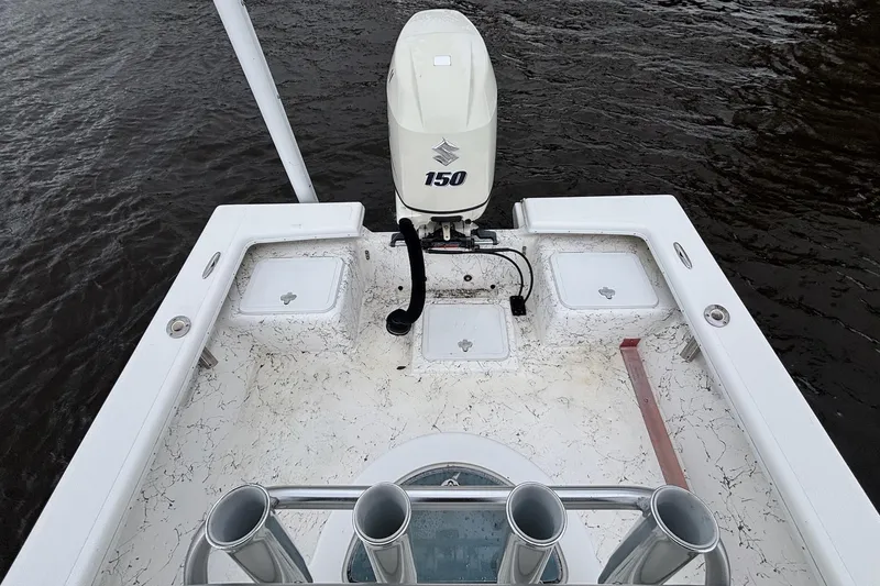 Slide: The Image of 2014 Riddick Bay Runner 2290 boat with 150 HP outboard motor on water. - 11