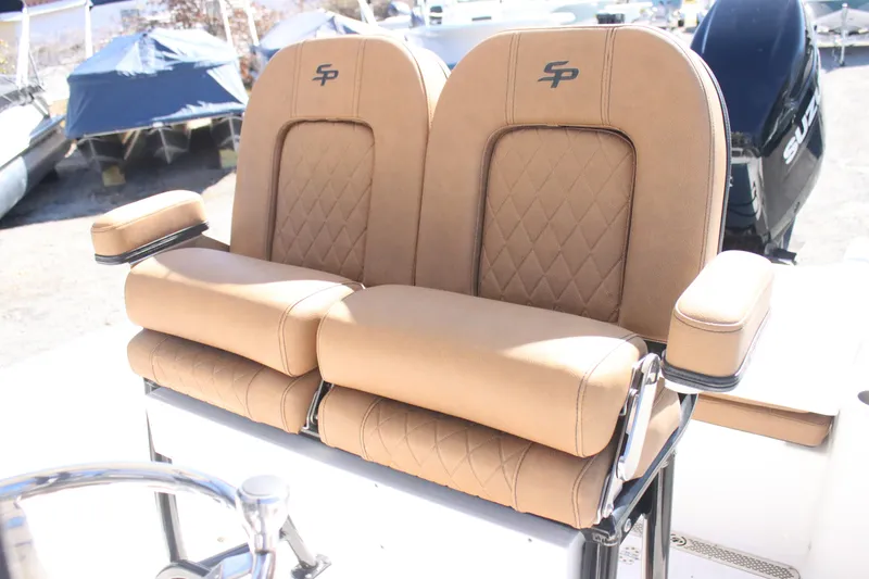 Slide: The Image of 2022 Sea Pro 248 Bay boat seats with tan upholstery and diamond stitching. - 10