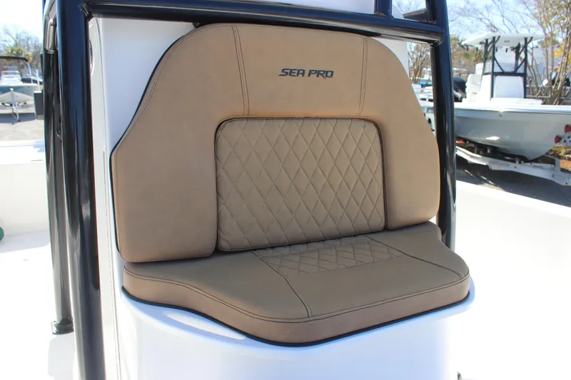 Slide: The Image of 2022 Sea Pro 248 Bay boat seat with tan upholstery and diamond stitching. - 13