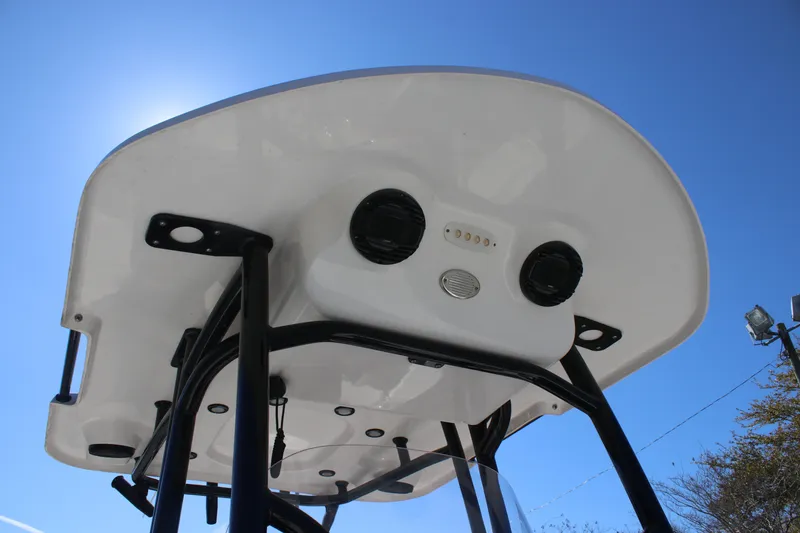 Slide: The Image of 2022 Sea Pro 248 Bay boat T-top viewed from below against clear blue sky. - 14