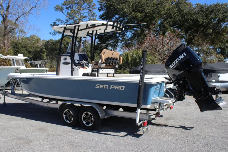 Slide: The Image of 2022 Sea Pro 248 Bay boat with Suzuki outboard motor on a trailer. - 2
