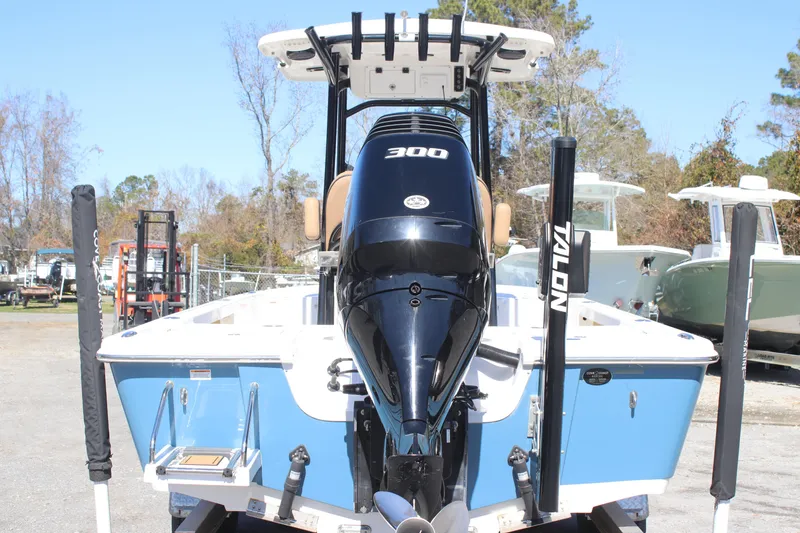 Slide: The Image of 2022 Sea Pro 248 Bay boat with powerful 300 engine, displayed outdoors. - 5
