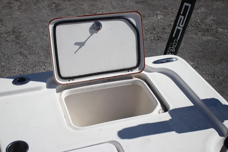 Slide: The Image of Open storage compartment on 2022 Sea Pro 248 Bay boat, showcasing interior space. - 8