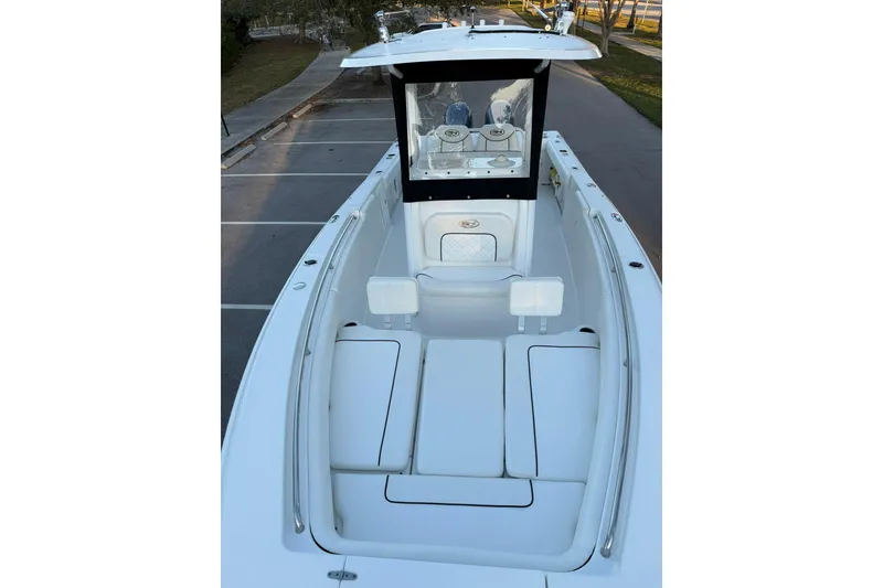 Slide: The Image of 2014 Sea Hunt Gamefish 27 boat with spacious deck and seating area. - 25