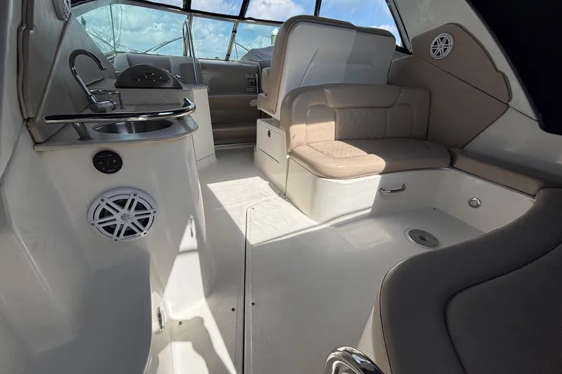 Slide: The Image of Interior of 2009 Sea Ray Sundancer 310 boat with seating and kitchenette. - 10