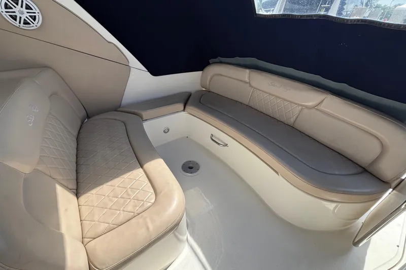 Slide: The Image of 2009 Sea Ray Sundancer 310 interior with beige leather seating and elegant design. - 11