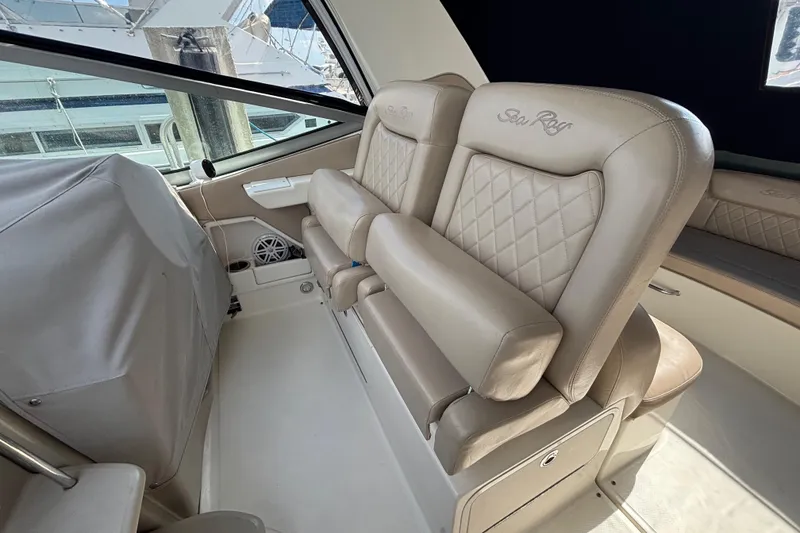 Slide: The Image of 2009 Sea Ray Sundancer 310 interior with beige leather seating and elegant design. - 17
