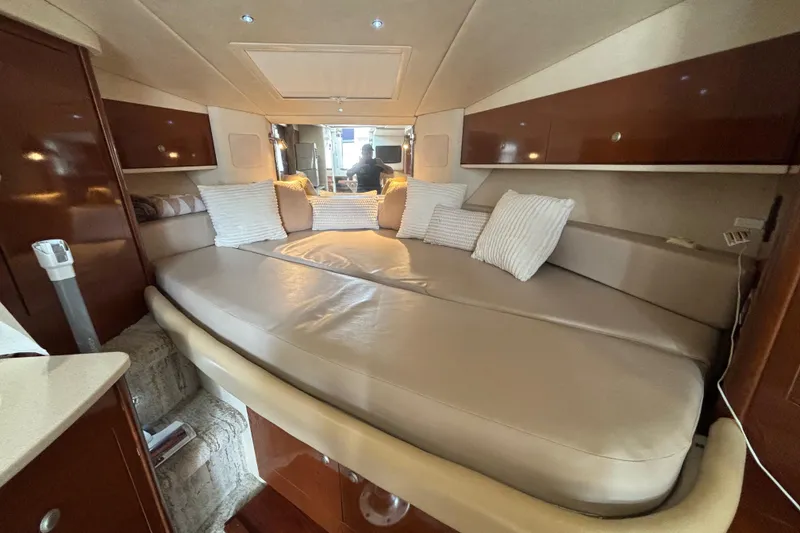 Slide: The Image of Interior of 2009 Sea Ray Sundancer 310 with cozy seating and cushions. - 32