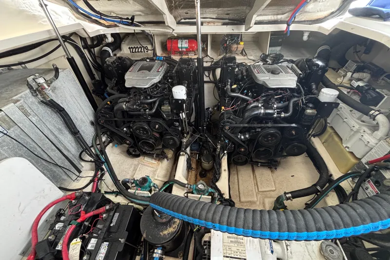 Slide: The Image of Engine room of a 2009 Sea Ray Sundancer 310 with dual engines and wiring. - 34