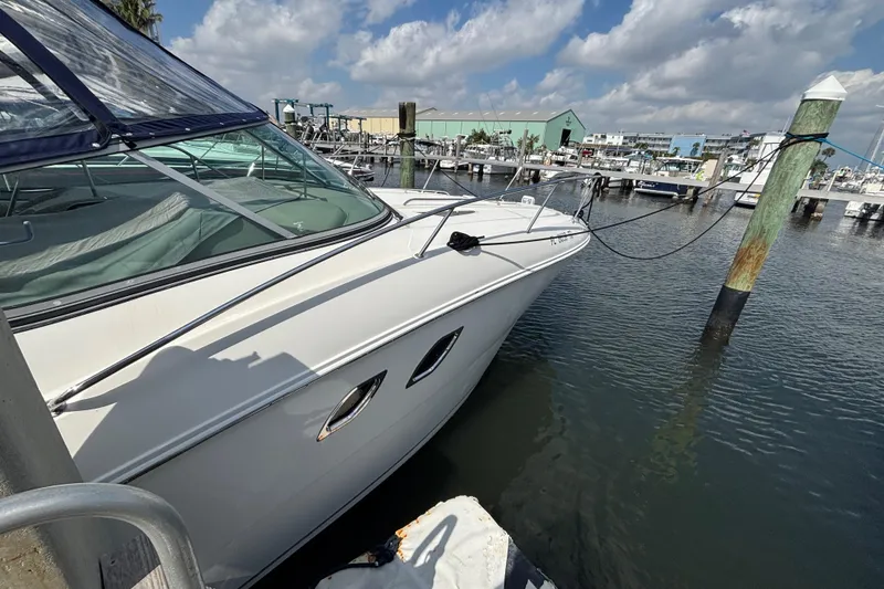 Slide: The Image of 2009 Sea Ray Sundancer 310 docked at marina under blue sky. - 6